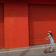 A child rides a scooter through Venice, California in late April 2020.
